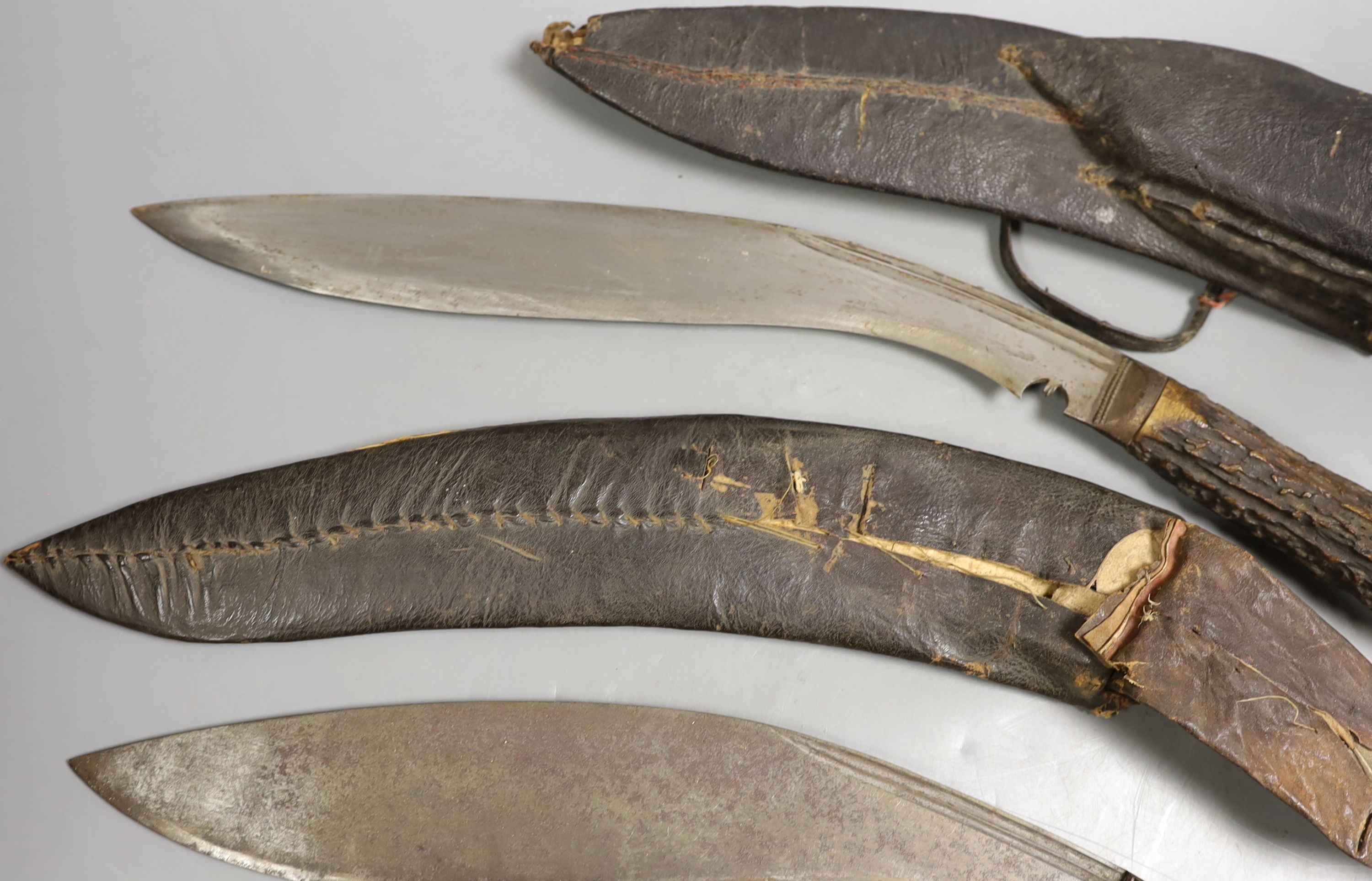 Two Nepalese kukri knives, antler handle knife 55cms long.